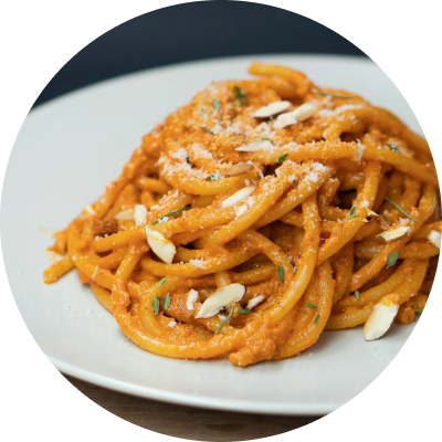 Spaghetti with a red sauce on a white plate