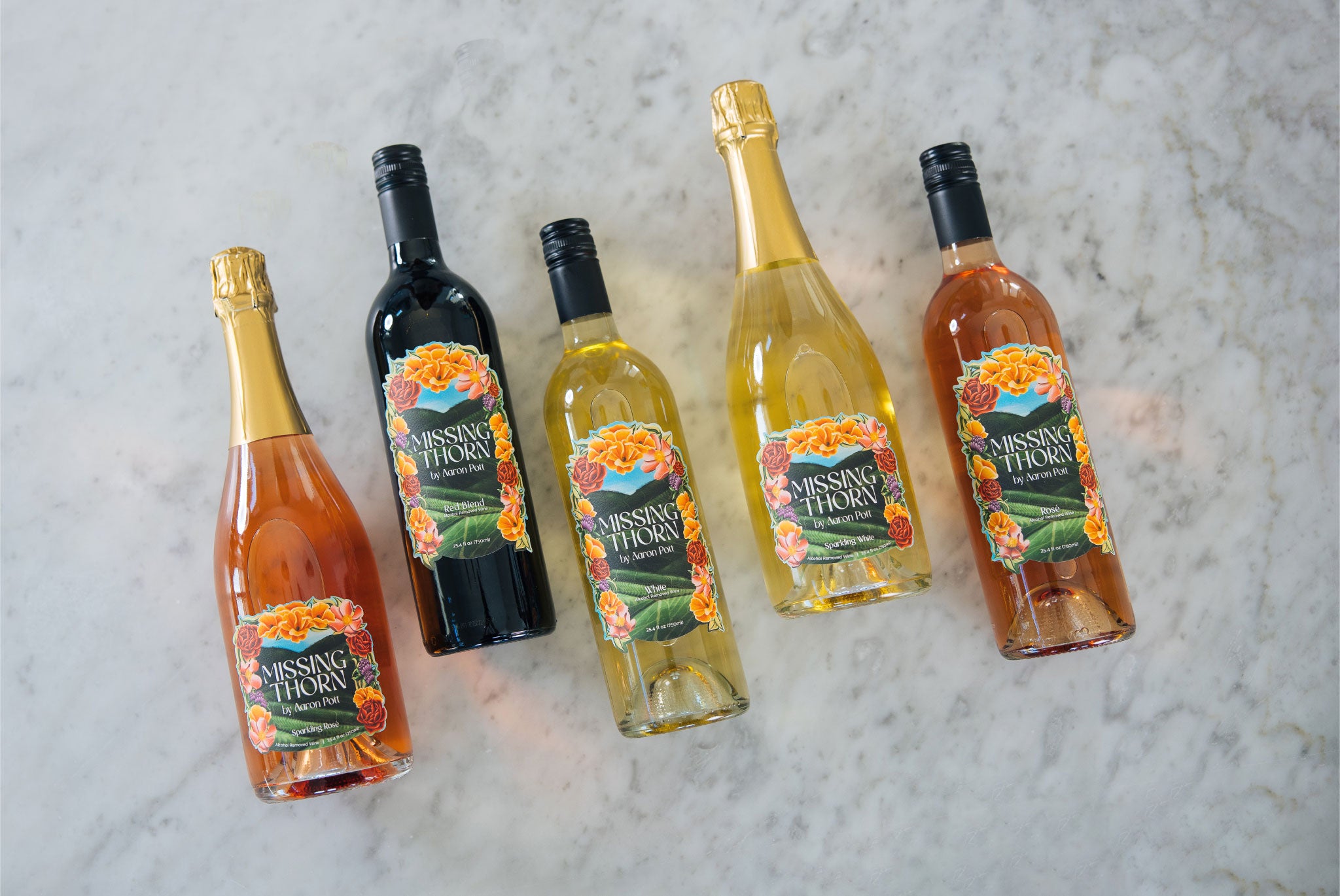Five bottles of non alcoholic wines from Missing Horn on a marble surface