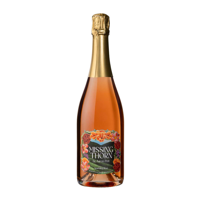 Bottle of Missing Thorn sparkling wine on a white background